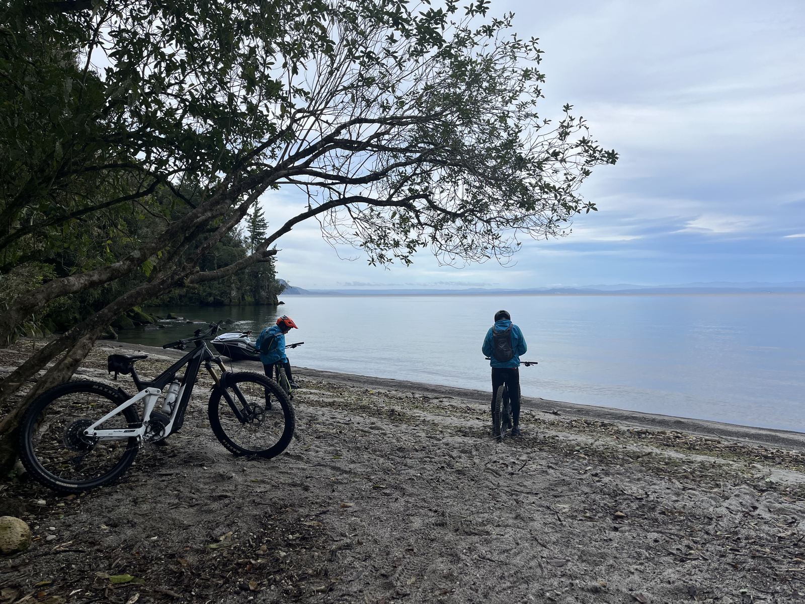 Riders stopped on the lake shore