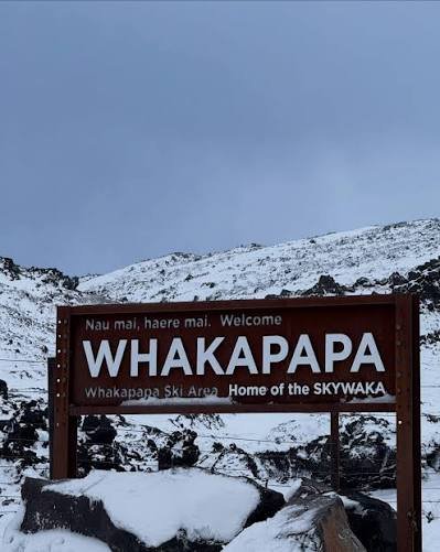 Whakapapa welcome sign against the snowfield